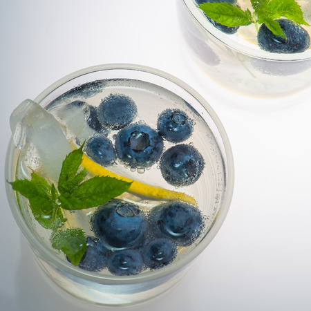 Summer lemonade with blueberries, lemon and mint. Top view.の写真素材