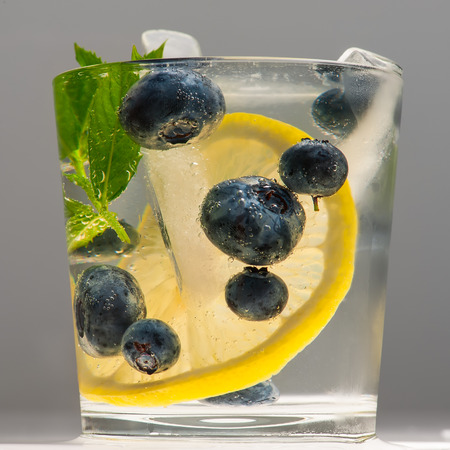 Summer lemonade with blueberries, lemon and mint.の写真素材