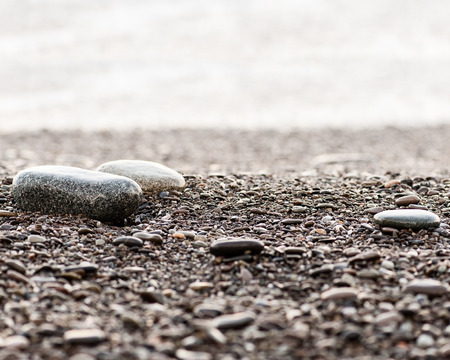 Close-up of beach pebbles in the dusk.の写真素材