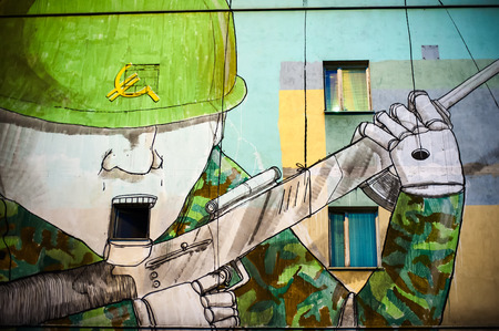 Warsaw, Poland - June 5, 2011: Warsaw political graffiti. Political Graffiti: Bluâs Soldier Puppets on the building in Warsaw.のeditorial素材