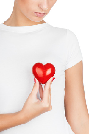 Giving love concept with hand holding a red heart.の写真素材