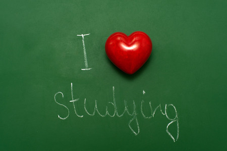 'I love studying' phrase written on green chalkboard.の写真素材