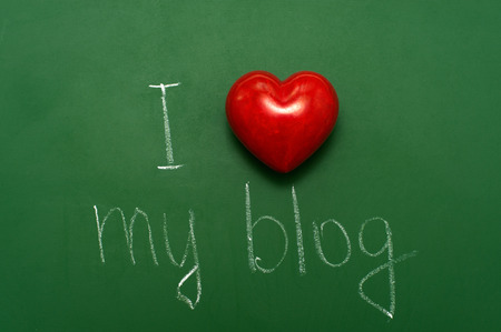 "I love my blog" handwritten on school green chalkboard.の写真素材