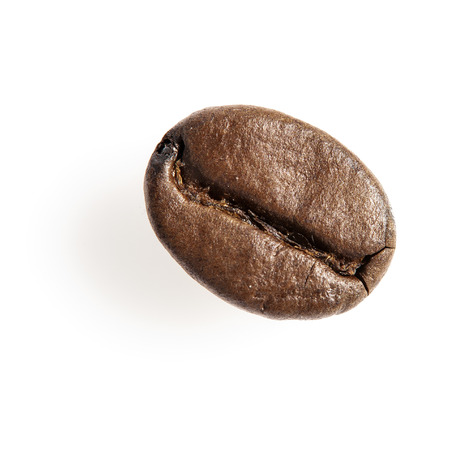 Close-up of a single roasted coffee bean isolated on white. Studio shot.の写真素材