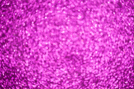 Pink background with shimmering glitter - Defocused lights.の写真素材