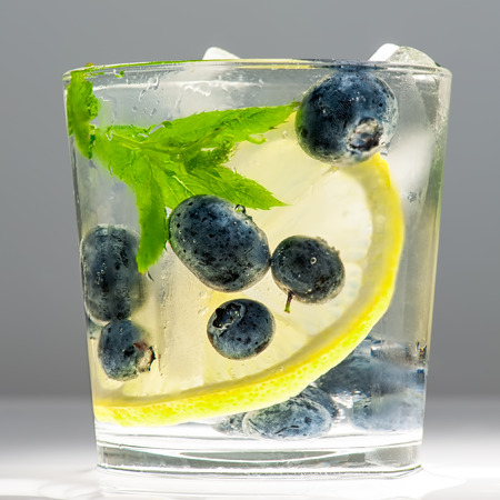 Summer lemonade with blueberries, lemon and mint.の写真素材