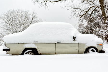 Retro car under the snowの写真素材