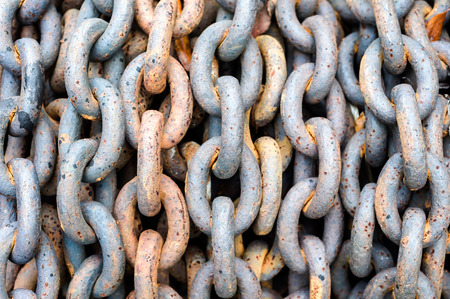 Rows of old rusty ship anchor chain links,  close-up, shallow DOF.の写真素材