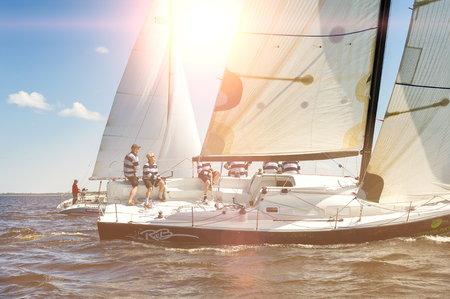 Kyiv, Ukraine - May 22, 2010: Sailing crew on sailboat during Hetman Cup regatta on May 20 th 2010 in Kyiv sea (Dnipro river), Kyiv, Ukraine. This is the eleventh season of the Vadym Hetman Cup.のeditorial素材