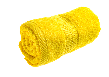 Yellow rolled towel Isolated on white background.の写真素材