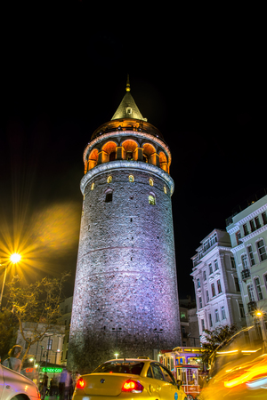 ISTANBUL, TURKEY - APRRIL 16, 2016: Night view over illuminated galata tower with cars blur in Istanbul, Turkey. The Galata Tower (Galata Kulesi) is a medieval stone tower in the Karakoy quarter.のeditorial素材