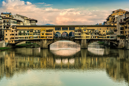 Ponte Vecchio, old bridge, medieval landmark on Arno river and its reflection. Florence, Tuscany, Italy.の写真素材