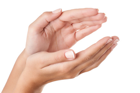 Two hands holding something invisible isolated on pure white background. Close-up composition, retouched.の写真素材