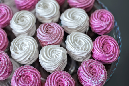 Pink and white marshmallows (meringue,zephyr), soft selective focus background.の写真素材