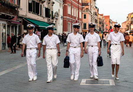 VENICE, ITALY - SEPTEMBER 22, 2012: Gorgeous Cabin Crew of Passenger ship in white uniform in the street on 22 September 2012 in Venice, Italy.のeditorial素材