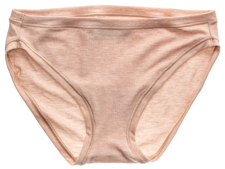 Women's beige cotton panties isolated on white background. Beige underwear.の写真素材