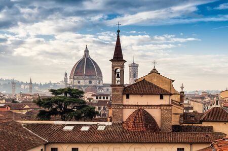Florence cityscape with cathedral of Santa Maria del Fiore in the background, Florence (Firenze), Italy. Roofs level.の写真素材