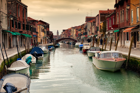 View of the colorful Venetian houses along the canal at the Islands of Murano in Venice, Italy.の写真素材