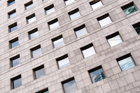 Abstract building background, facade view of business building with windows.