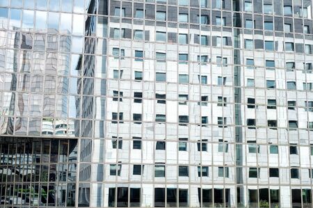 Business skyscrapers in reflection. La Defense financial district in Paris, France.Futuristic corporate office buildings. Business abstract background. Mirror skyscraper.のeditorial素材
