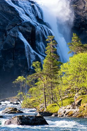 Giant waterfall of Husedalen valley and Hardangervidda National Park. The trail through Husedalen valley is one of the most beautiful hikes in Norway.の写真素材