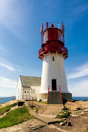 The World famous Lindesnes Fyr Lighthouse on most southern point of Norway staying on the edge of rocky sea coast, , South Norway, Lindesnes Fyr beacon.のeditorial素材