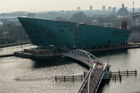 AMSTERDAM, NETHERLANDS - APRIL 10, 2018: NEMO Science Museum (from latin Nobody) is a science center in Amsterdam, Netherlands.のeditorial素材