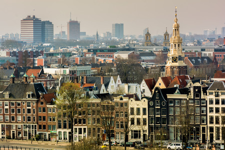 AMSTERDAM, NETHERLANDS - APRIL 10, 2018: Amsterdam skyline cityscape from the Oosterdok in the Netherlands.のeditorial素材
