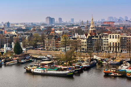 AMSTERDAM, NETHERLANDS - APRIL 10, 2018: Amsterdam skyline cityscape from the Oosterdok in the Netherlands. The Oosterdok is a chanel in Amsterdam .の写真素材