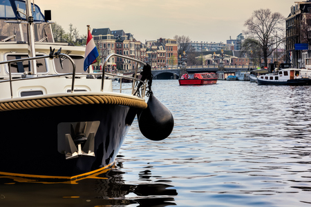 Dutch flag on the boat. Spring sunny Amsterdam.の写真素材