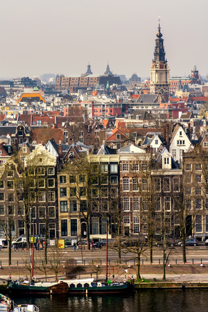 AMSTERDAM, NETHERLANDS - APRIL 10, 2018: Amsterdam skyline cityscape from the Oosterdok in the Netherlands. The Oosterdok is a chanel in Amsterdam .の写真素材