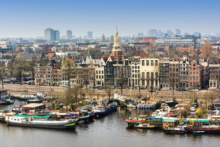 AMSTERDAM, NETHERLANDS - APRIL 10, 2018: Amsterdam skyline cityscape from the Oosterdok in the Netherlands.のeditorial素材