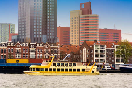 ROTTERDAM, NETHERLANDS - APRIL 13, 2018: Rotterdam embankment with skyscrapers and ships and the river Nieuwe Maas. Rotterdam is the second-largest city and a municipality of the Netherlands.のeditorial素材