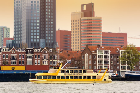ROTTERDAM, NETHERLANDS - APRIL 13, 2018: Rotterdam embankment with skyscrapers and ships and the river Nieuwe Maas. Rotterdam is the second-largest city and a municipality of the Netherlands.のeditorial素材