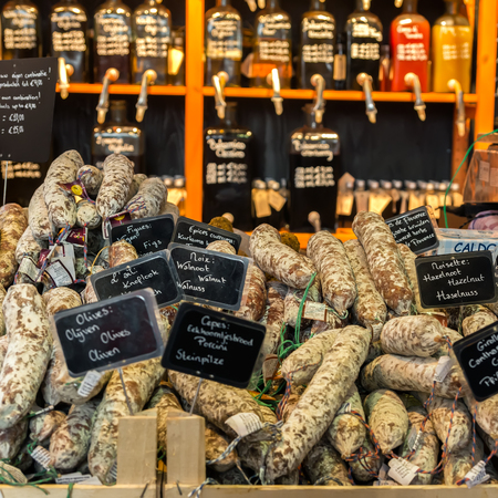 ROTTERDAM, NETHERLANDS - APRIL 13, 2018: A selection of sausages for sale on market in Rotterdam Netherlands. The Markthal (English: Market Hall) is a market hall underneath, located in Rotterdam.のeditorial素材
