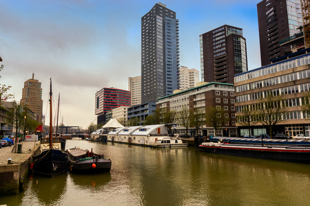 ROTTERDAM, NETHERLANDS - APRIL 13, 2018: Ships on river of the city Rotterdam. Buildings on background.のeditorial素材