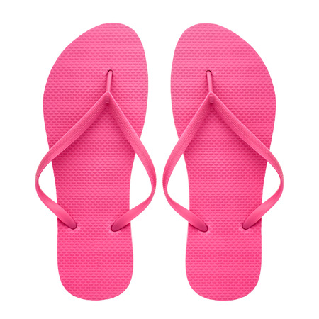 Pink rubber flip-flops isolated over white background, pair of thongs, shot above.の写真素材