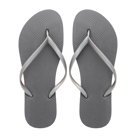 Grey rubber flip-flops isolated over white background, pair of thongs, shot above.の写真素材