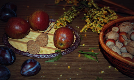 Life style. Still life. Autumn. Fruits and flowers on the wooden tableの写真素材