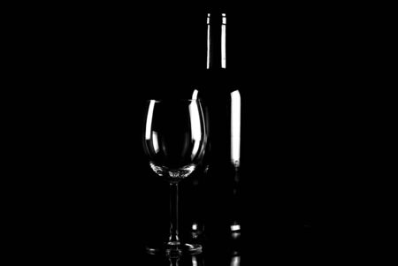 bottle of wine and wineglasses on black backgroundの写真素材