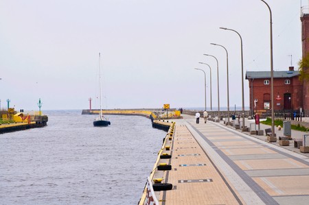 coming into port - walking river to the seaの写真素材