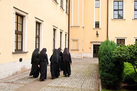 nuns walking on the squareの写真素材