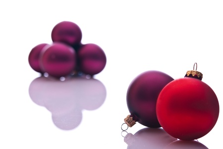 red and burgund christmas balls on whiteの写真素材