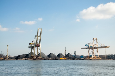 slag heaps of coal on the wharf in the port の写真素材