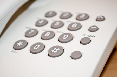 white telephone on desk
