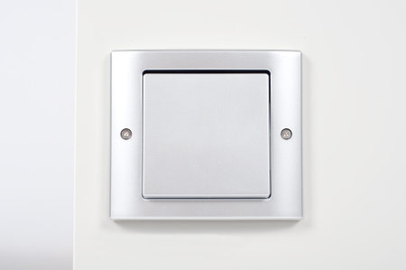 modern light switch on the wall close up