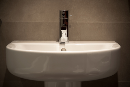 Wide oval basin and marble ceramics in bathroom の写真素材