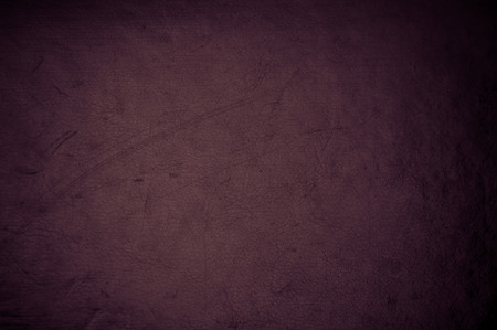 dark grunge scratched leather to use as backgroundの写真素材