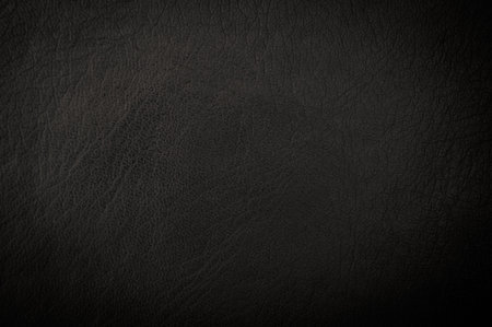 dark grunge scratched leather to use as background