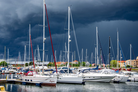 yacht or motor boat at harbor moored at Karlskrona in Swedenのeditorial素材